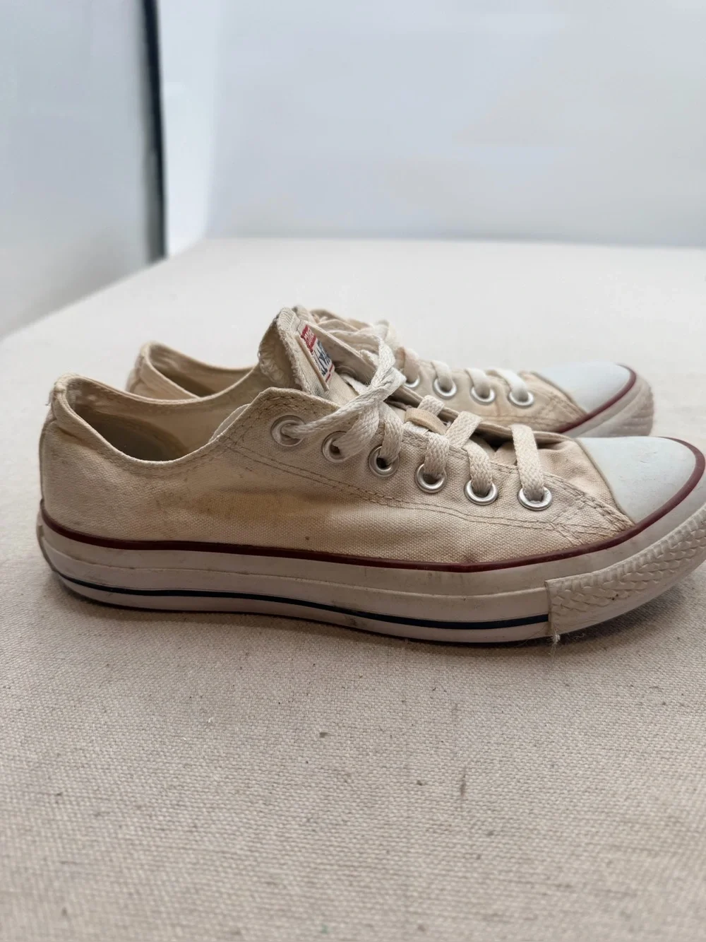 Converse Low Top Sneakers in Cream with Red Trim